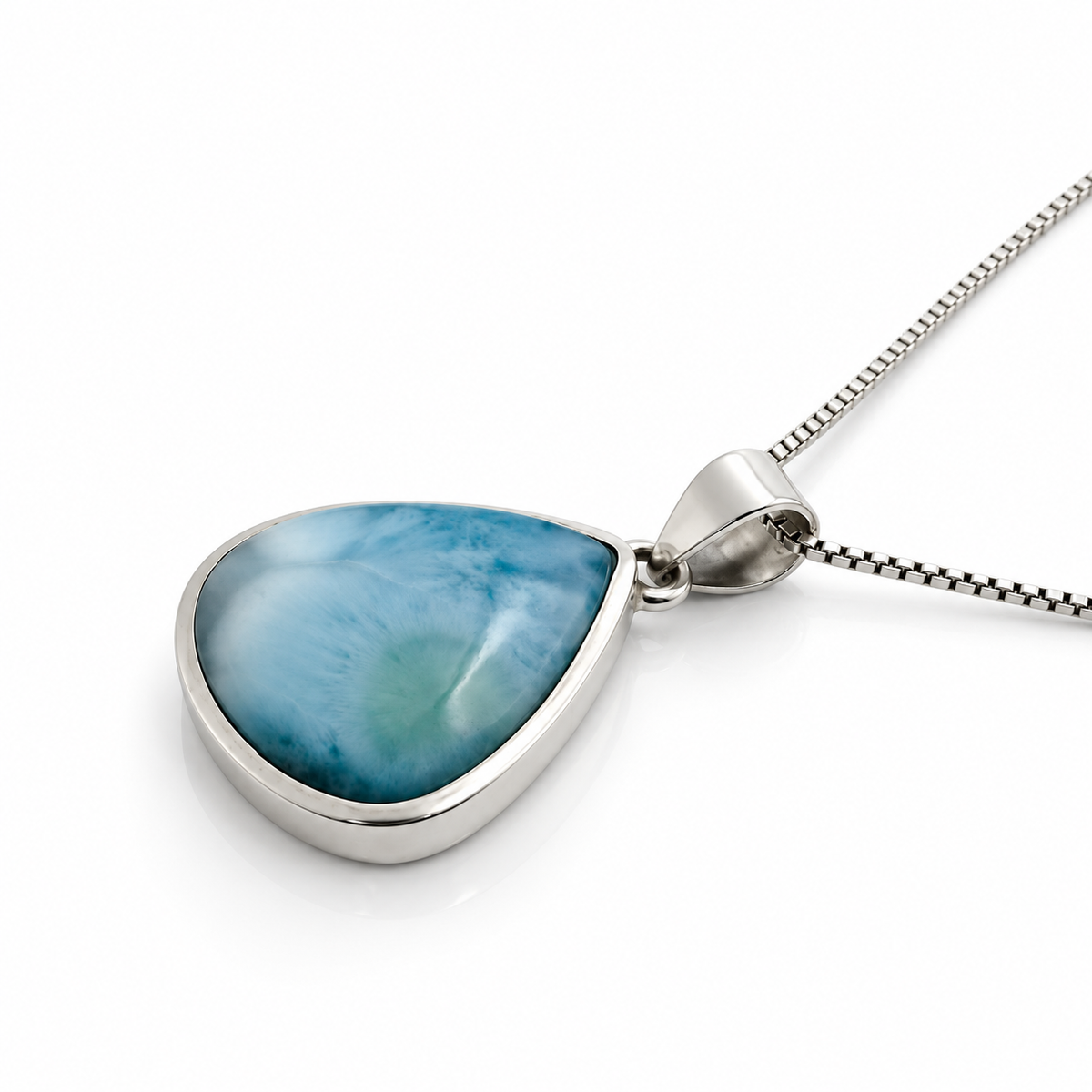 Left angled view of teardrop Larimar necklace with polished sterling silver setting and box chain