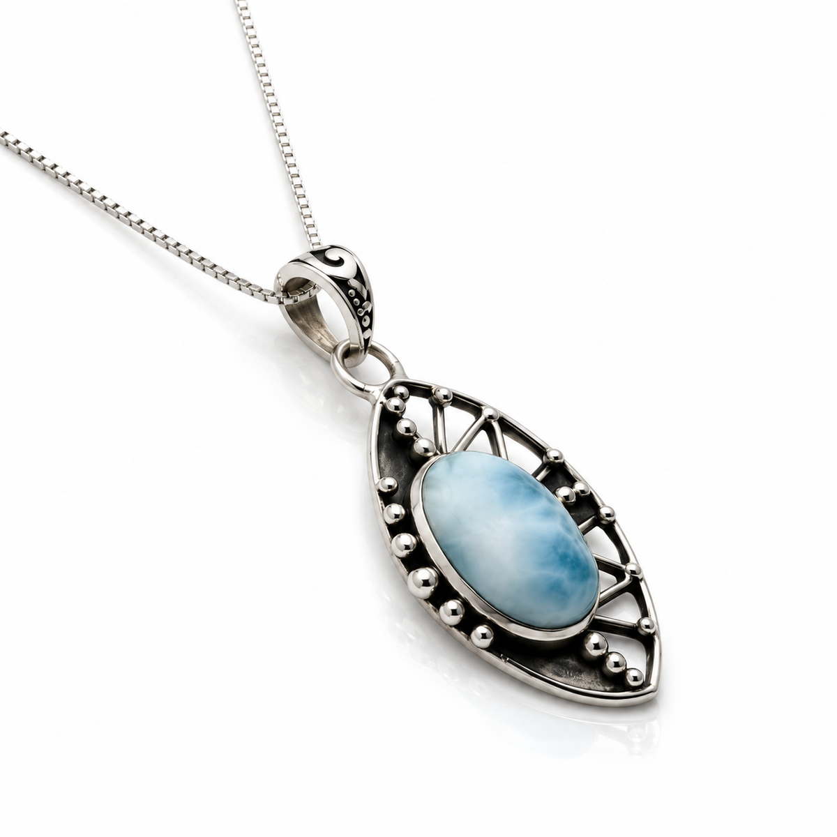 Larimar filigree necklace showing raised oval stone and sterling side profile