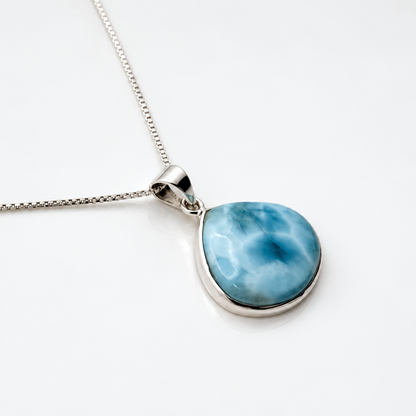 Larimar Blue Nebula necklace, angled view on glossy white