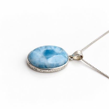 Larimar Blue Reverie necklace side profile showing the domed stone and textured silver bezel