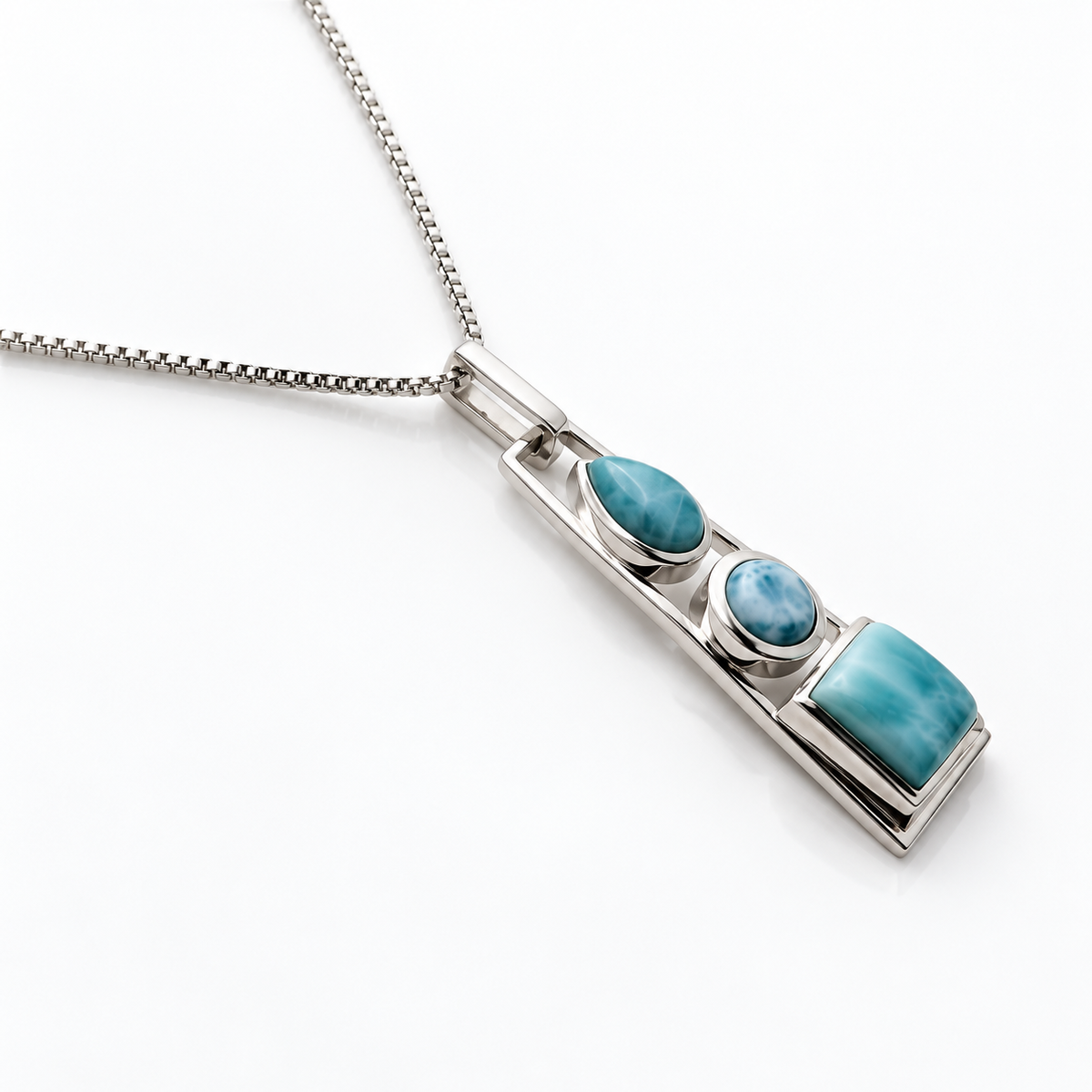 Three-stone Larimar necklace in a tapered sterling silver frame, angled view