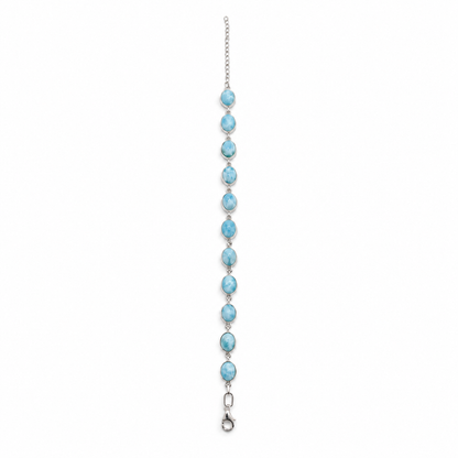 Larimar sterling silver link bracelet, full 9-inch length with extender, straight view on white.