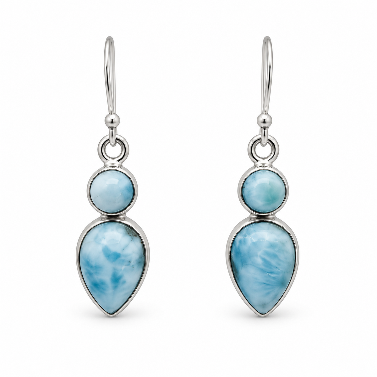 Front view of two-stone Larimar earrings with a round stone above a downward teardrop in silver bezels.