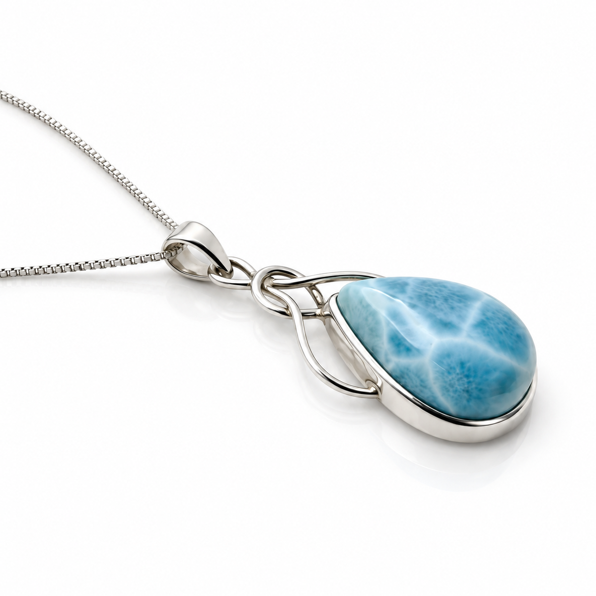Larimar Ocean Embrace necklace low angle view on glossy white background