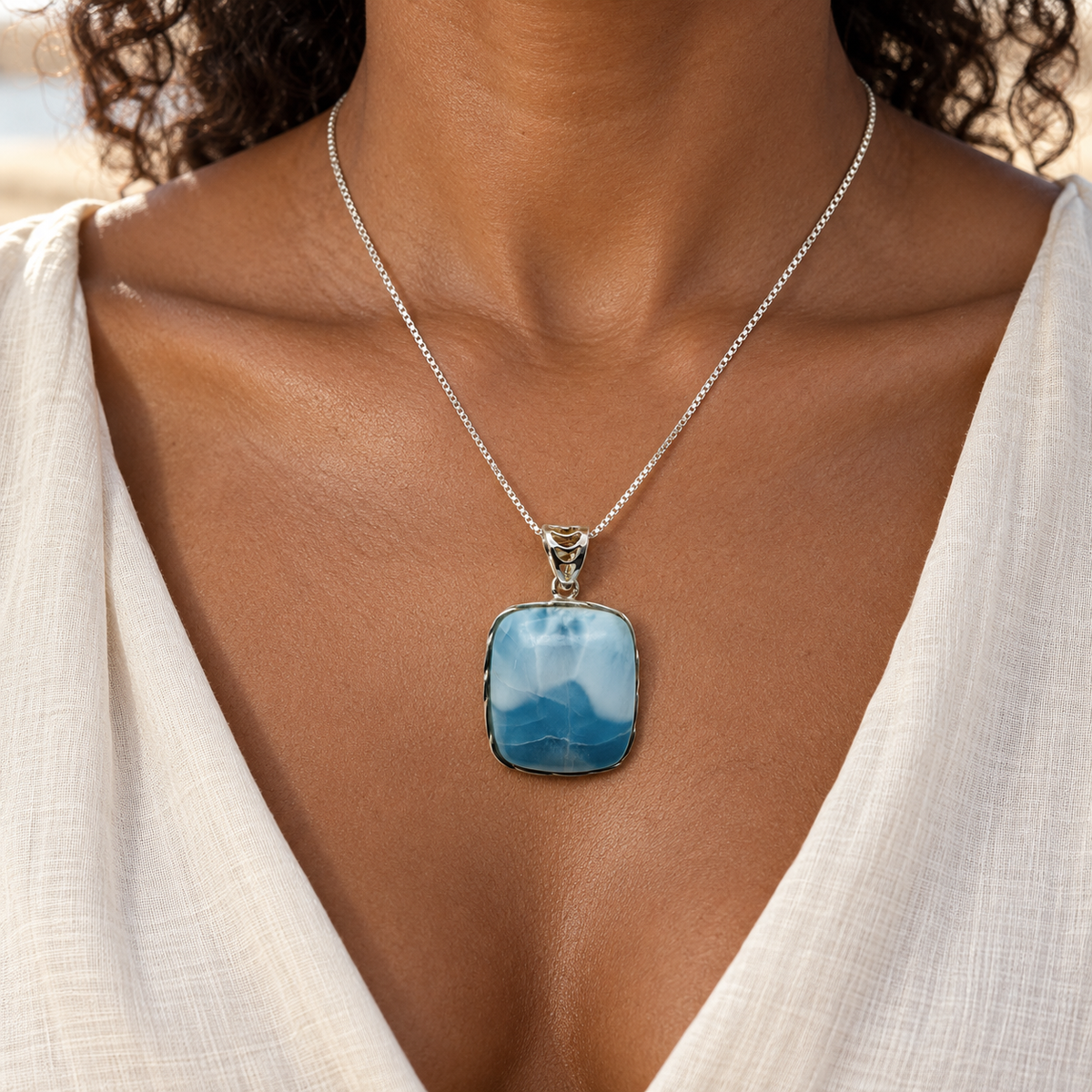 Larimar Ocean Summit necklace worn on model, scaled to 1 inch wide by 1.3 inches high