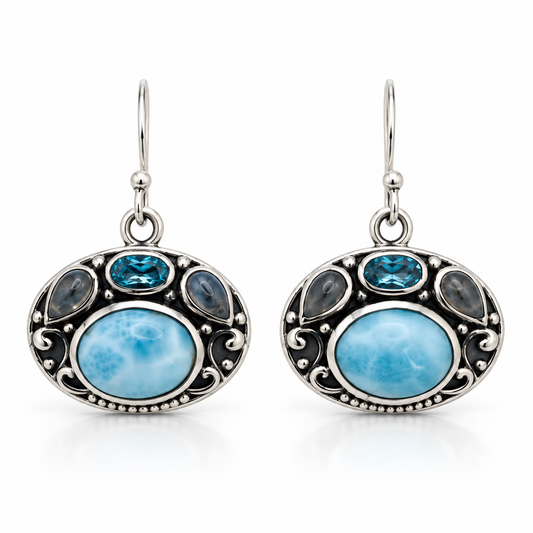 Ornate oval Larimar earrings with blue and gray accent stones in oxidized sterling silver, front view.