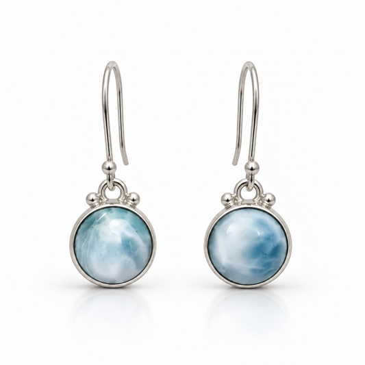 Round Larimar drop earrings in sterling silver with open ear wires, front view on white.