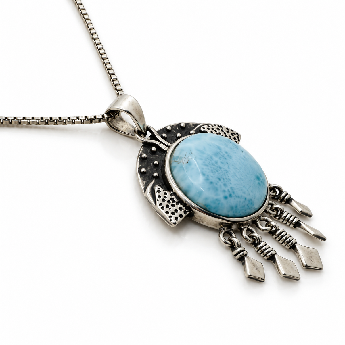 Round Larimar necklace with oxidized sterling silver details and five hanging drops, angled view