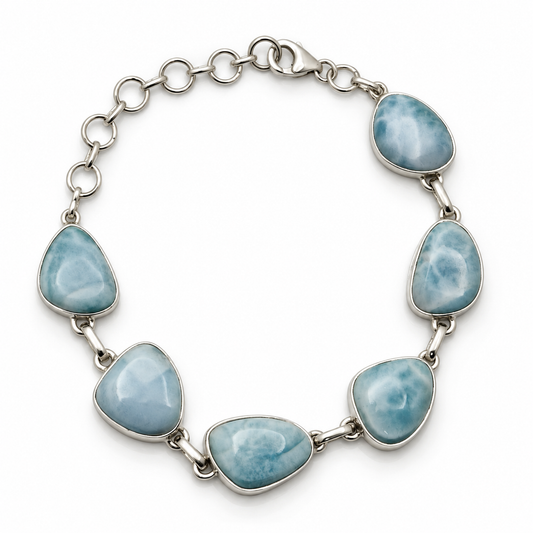 Six freeform Larimar stones in a sterling silver link bracelet, loop view on white.
