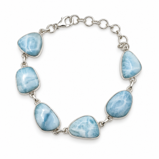 Six freeform Larimar stones in a sterling silver link bracelet, loop view on white.