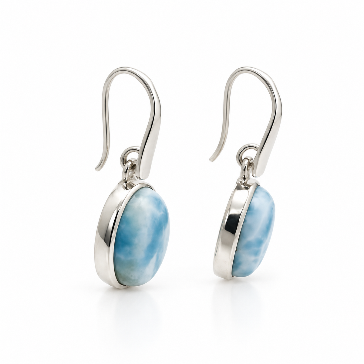 Oval Larimar earrings in smooth sterling silver bezels, angled side view.