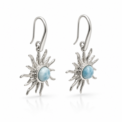Larimar sunburst earrings in polished sterling silver, angled view on white.