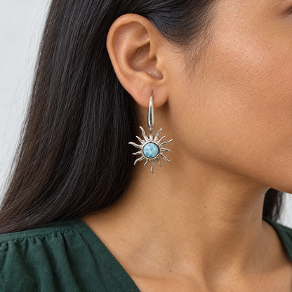 Larimar sterling silver sunburst earring on a dark-haired model in a green blouse, approximate scale for 0.8 inch width and 1.3 inch total height.