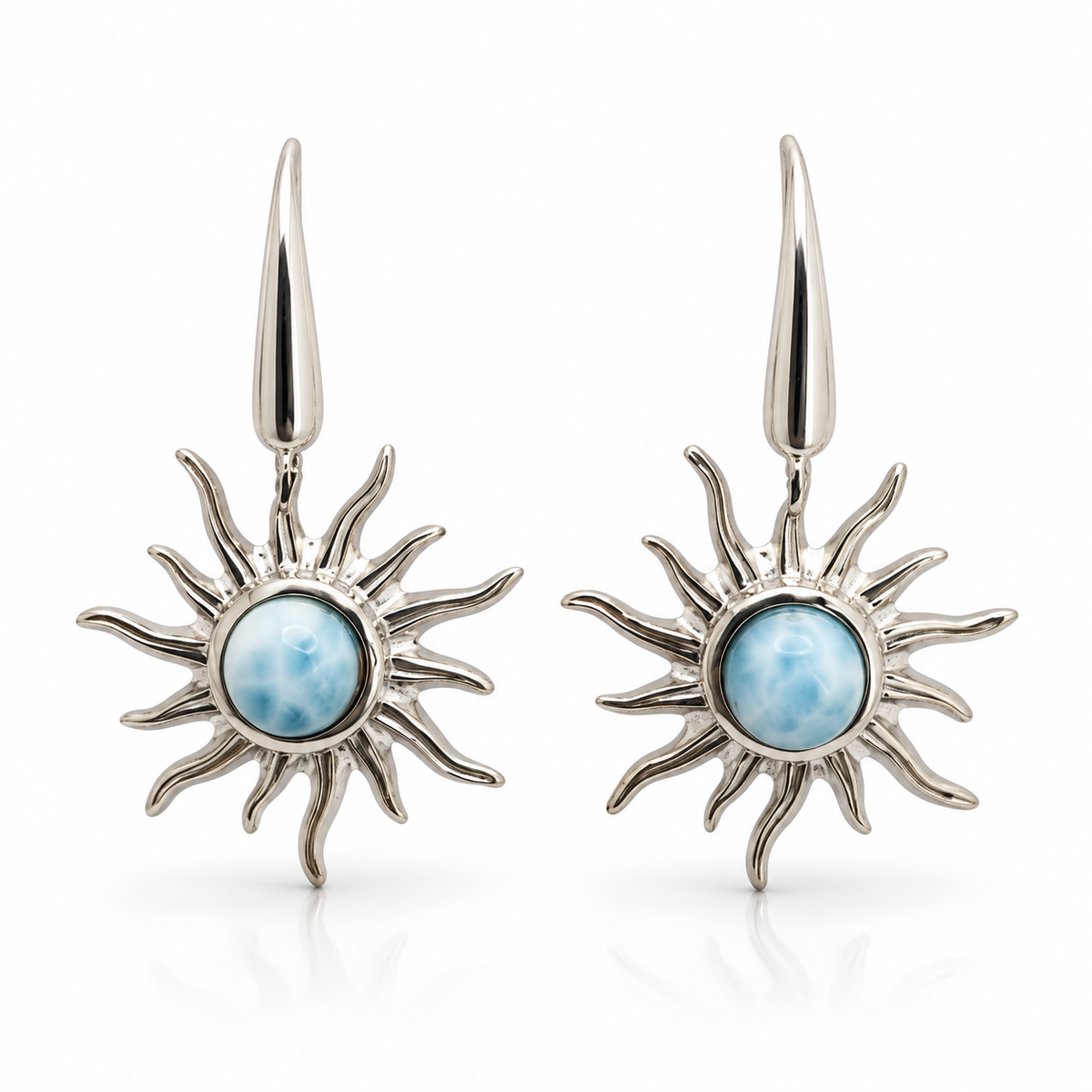 Larimar sunburst earrings with wavy sterling silver rays, front view on white.