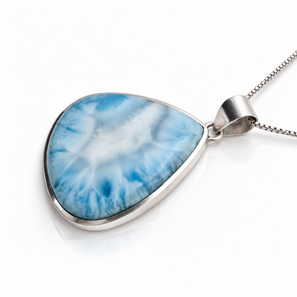 Angled view of blue and white teardrop Larimar necklace in sterling silver with box chain