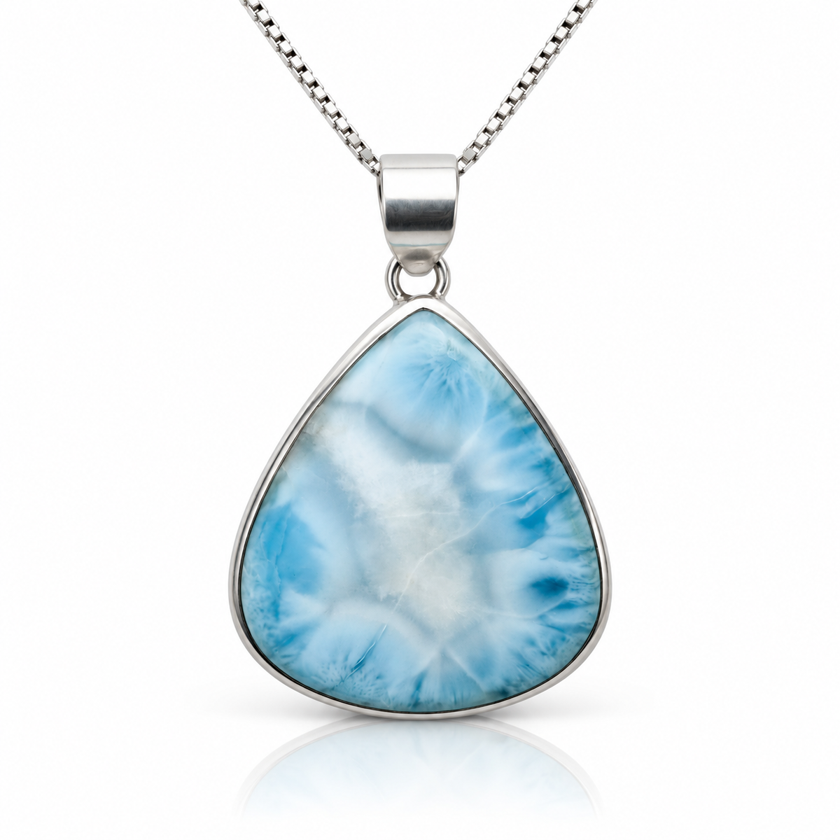 Front view of blue and white teardrop Larimar necklace on glossy white