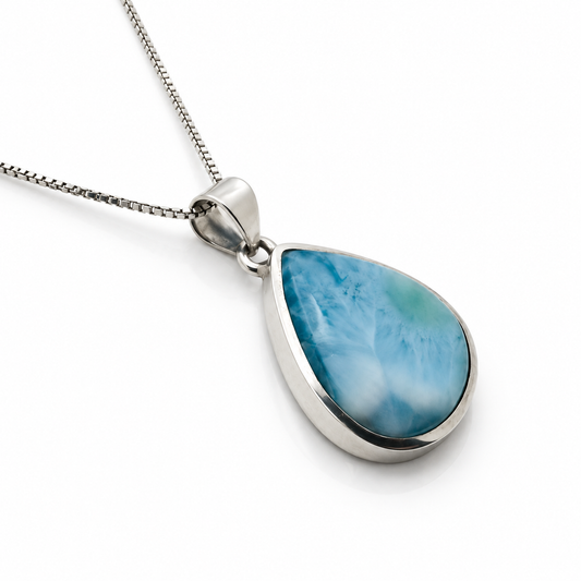 Right angled view of teardrop Larimar necklace with polished sterling silver setting and box chain