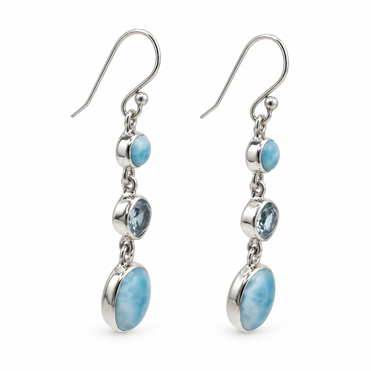 Angled view of three-stone Larimar drop earrings with polished sterling silver bezels.