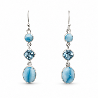 Three-stone drop earrings with round Larimar, faceted blue cushion stones and oval Larimar in sterling silver, front view.