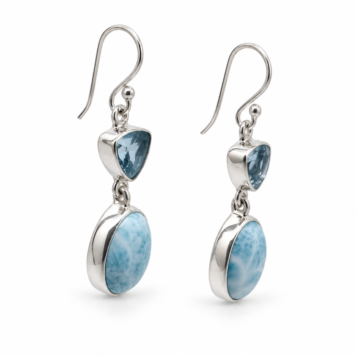 Angled view of Larimar and triangular blue gemstone earrings, polished silver with photographer reflections removed.
