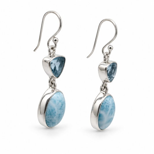 Angled view of Larimar and triangular blue gemstone earrings, polished silver with photographer reflections removed.