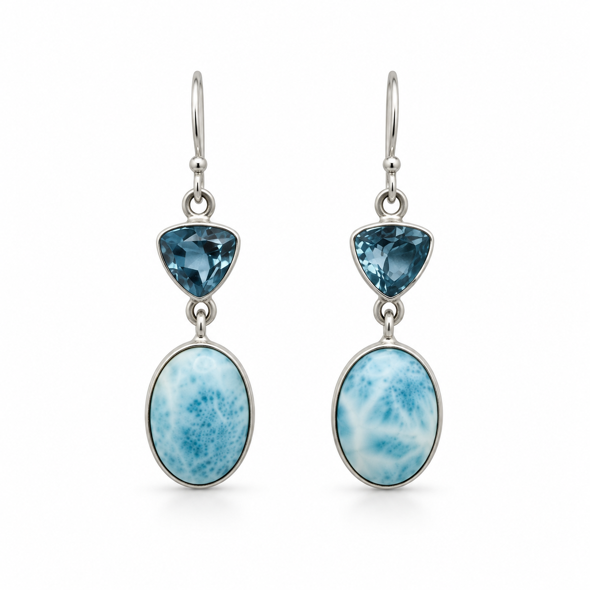 Larimar oval drop earrings with triangular blue gemstones in sterling silver, front view on white.