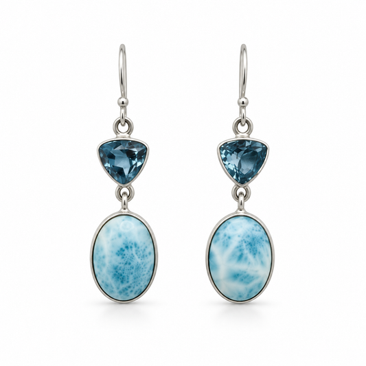 Larimar oval drop earrings with triangular blue gemstones in sterling silver, front view on white.
