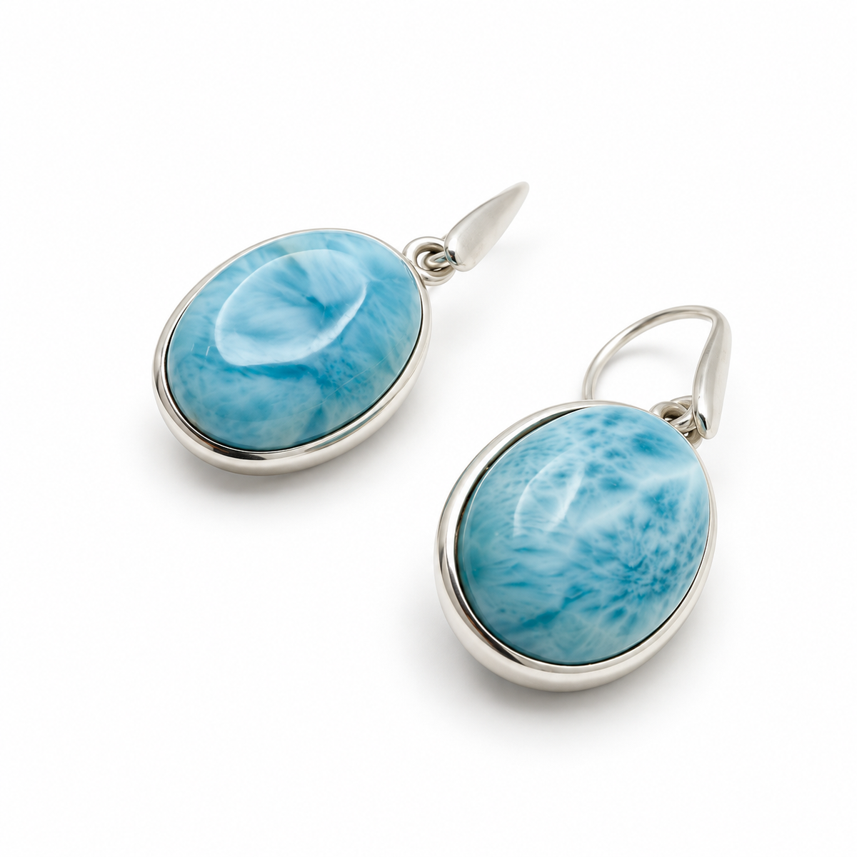 Oval Larimar drop earrings in sterling silver, close angled detail on glossy white