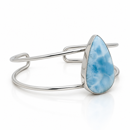 Teardrop Larimar sterling silver open cuff bracelet, angled view on glossy white